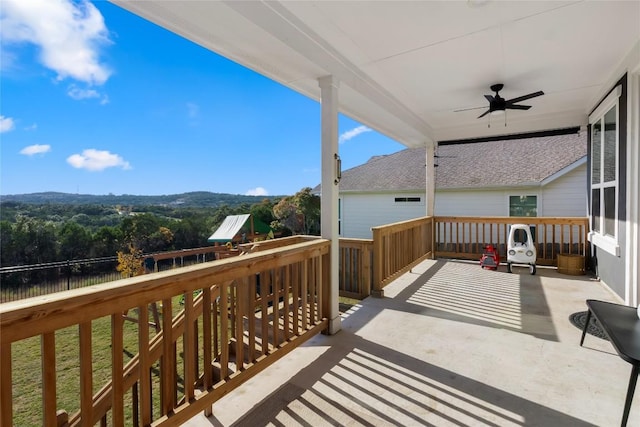 balcony featuring ceiling fan and a patio