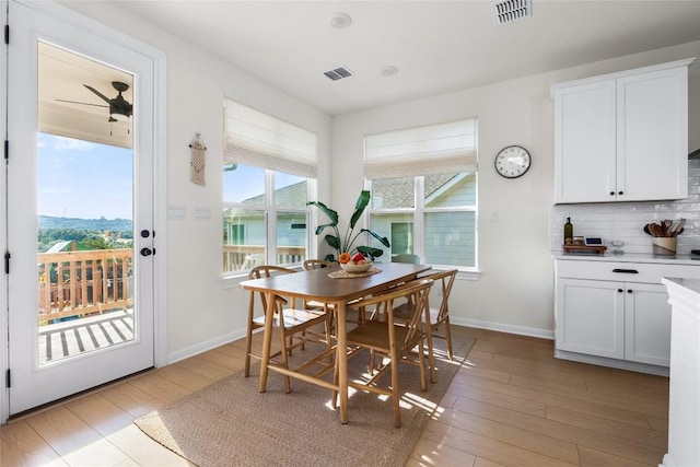 dining area with light hardwood / wood-style floors