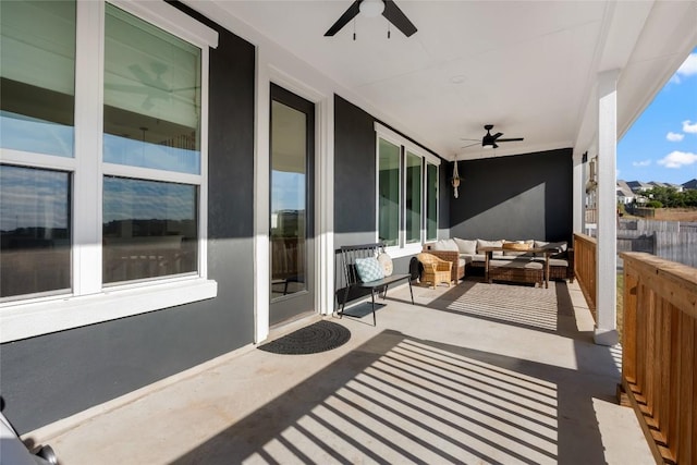 balcony with outdoor lounge area and ceiling fan