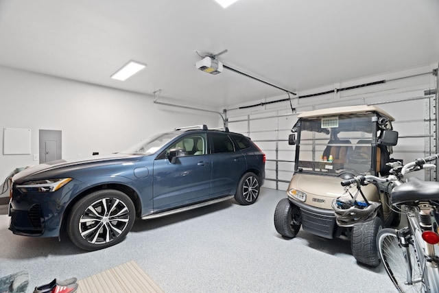 garage with electric panel and a garage door opener