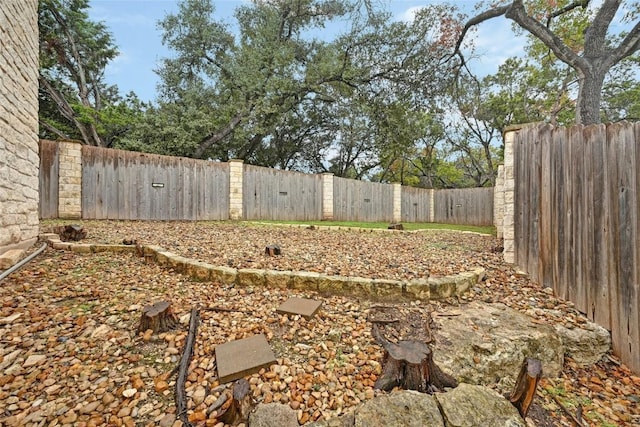 view of yard with a fenced backyard