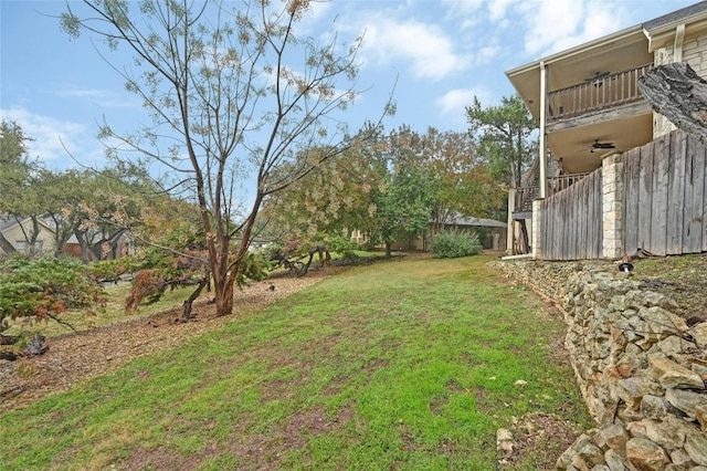 view of yard with stairway and a balcony