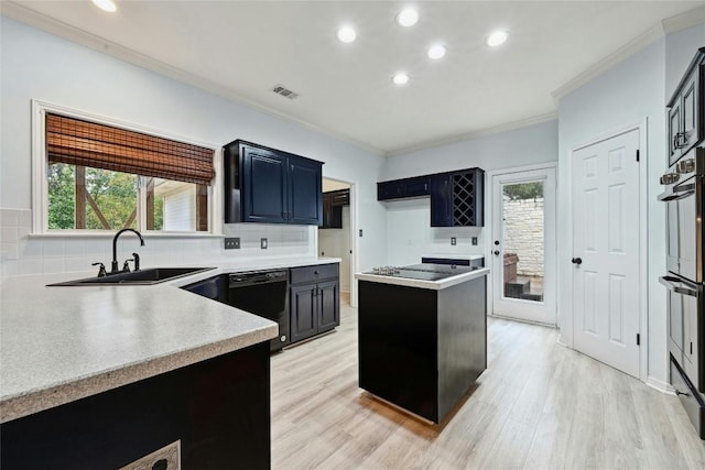 kitchen with visible vents, ornamental molding, a sink, black appliances, and backsplash