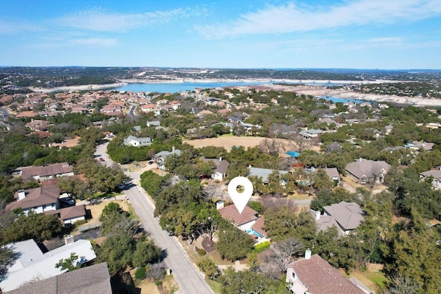 bird's eye view featuring a water view and a residential view