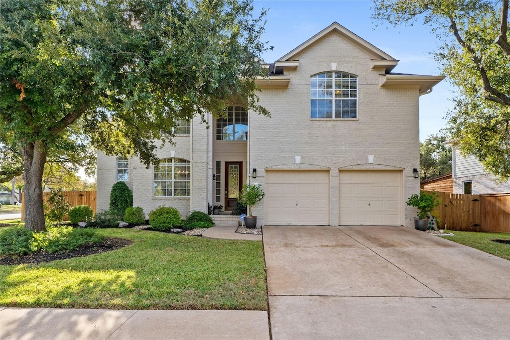 view of front of house featuring a garage and a front yard