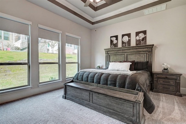 carpeted bedroom with ceiling fan and crown molding