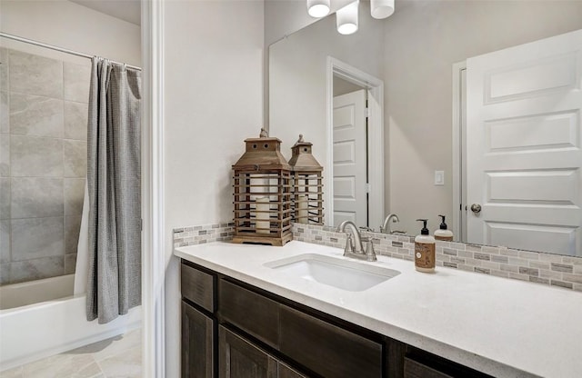 bathroom with tasteful backsplash, vanity, and shower / bath combo