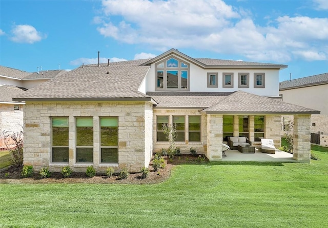 rear view of house with a patio area, an outdoor living space, and a yard