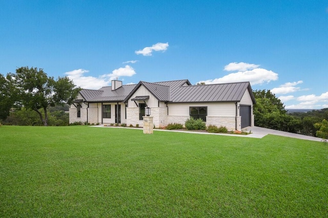 modern farmhouse style home featuring a front lawn and a garage