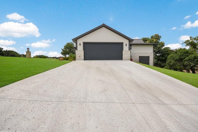 view of front facade with a front yard and a garage