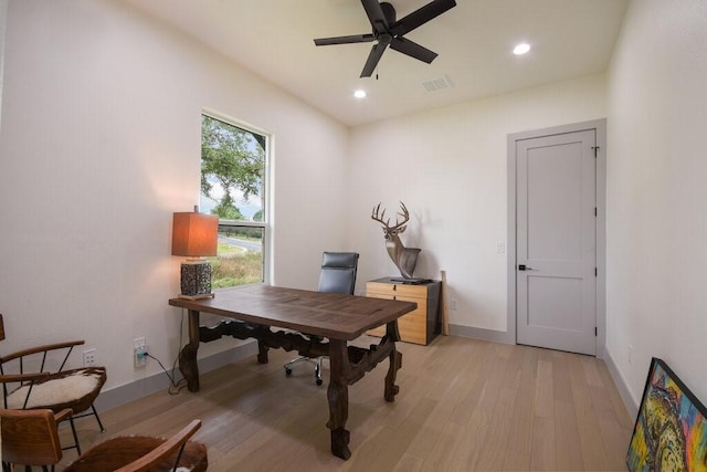 office space with light wood-type flooring and ceiling fan