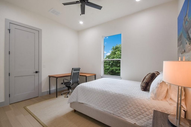 bedroom featuring ceiling fan and light hardwood / wood-style flooring