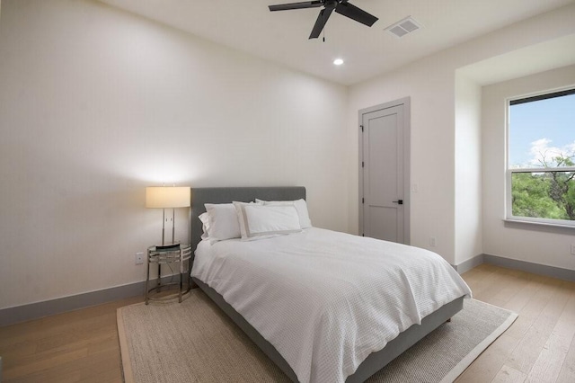 bedroom featuring ceiling fan and light hardwood / wood-style flooring