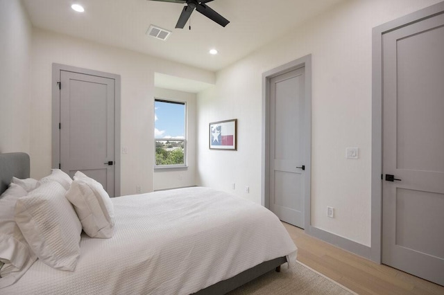 bedroom featuring light wood-type flooring and ceiling fan