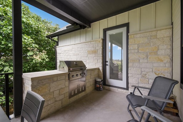 view of patio / terrace with area for grilling and a grill