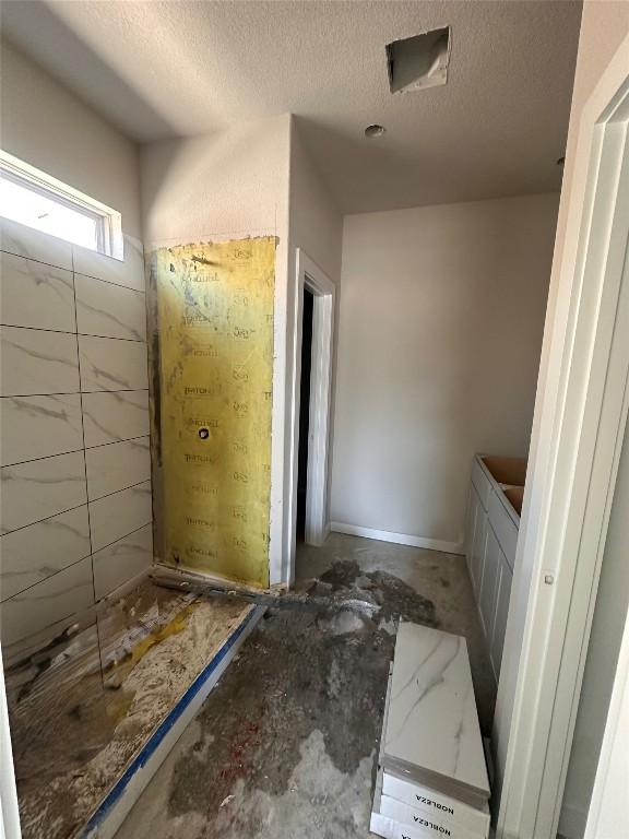 224 Lazy Lizzy Rd, Jarrell, TX 76537 - bathroom featuring a textured ceiling
