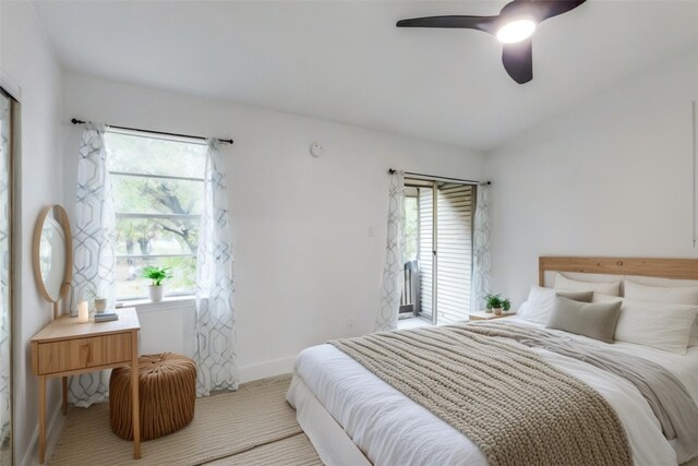 bedroom with ceiling fan and light colored carpet