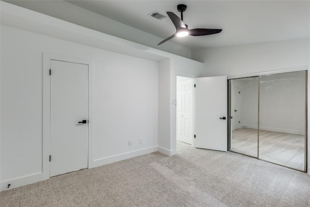 unfurnished bedroom with light carpet, lofted ceiling, and ceiling fan