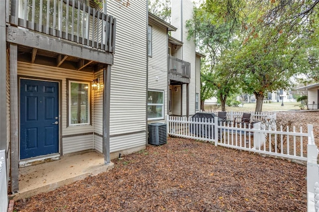 entrance to property with central AC and a balcony