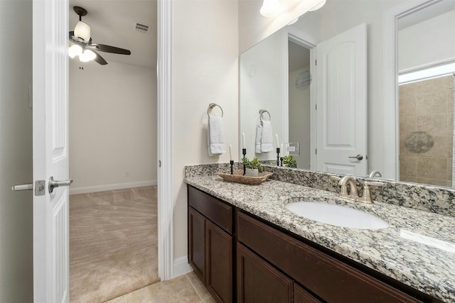 bathroom featuring tile patterned floors, vanity, and ceiling fan