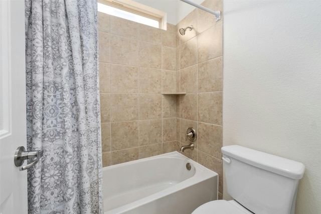 bathroom featuring shower / bath combination with curtain and toilet