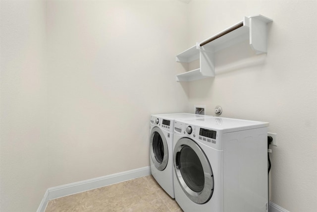 laundry room featuring separate washer and dryer