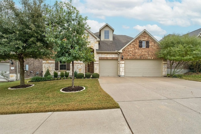 view of front of home with a front lawn and a garage