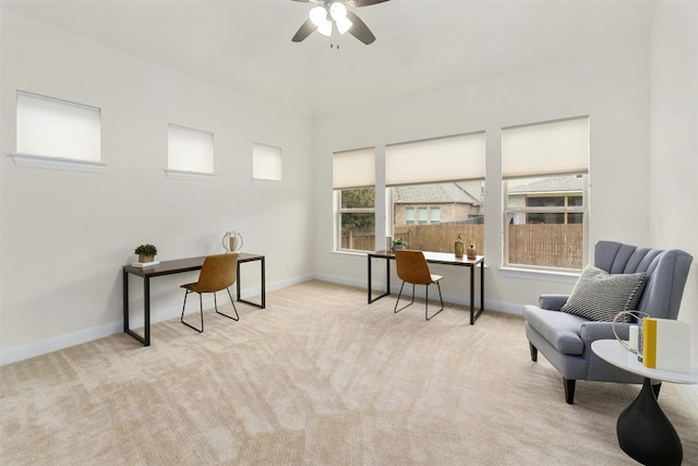 sitting room featuring light carpet and ceiling fan