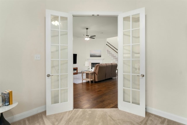 interior space featuring french doors, dark hardwood / wood-style flooring, and ceiling fan