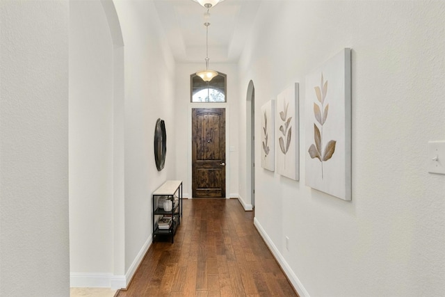 hall with dark hardwood / wood-style floors