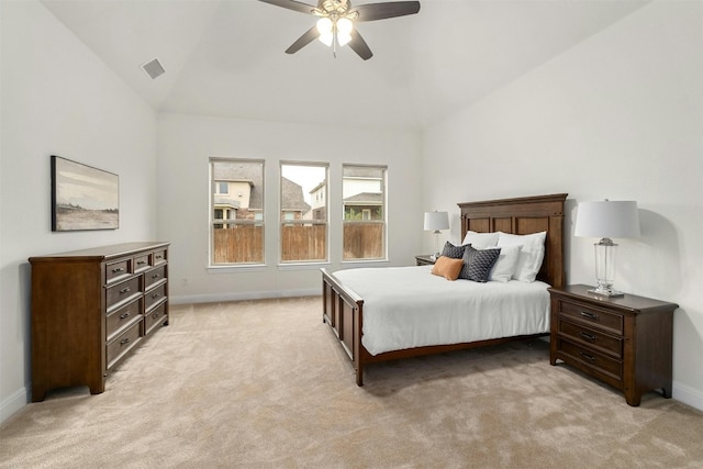 bedroom featuring light carpet, ceiling fan, and vaulted ceiling