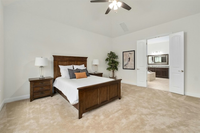 carpeted bedroom featuring ensuite bath, ceiling fan, and lofted ceiling