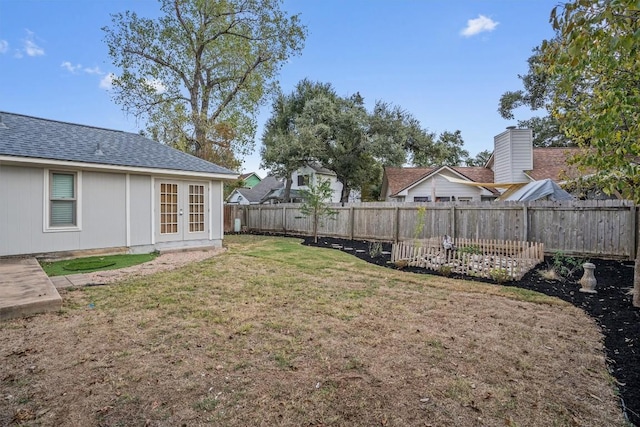 view of yard featuring french doors