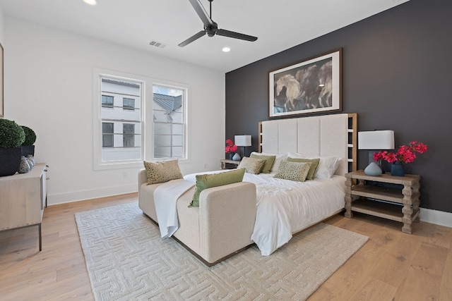 bedroom featuring ceiling fan and light hardwood / wood-style flooring