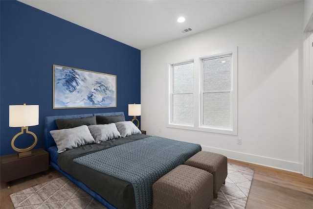 bedroom featuring wood-type flooring