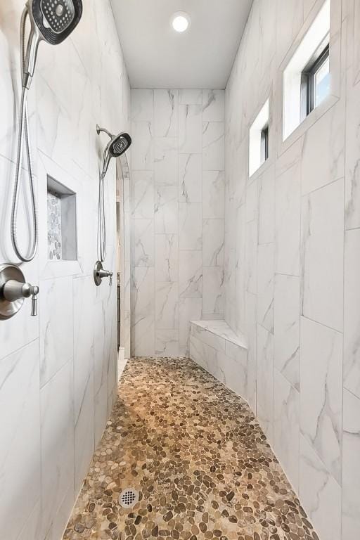 bathroom featuring tiled shower