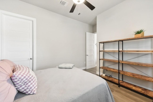 bedroom with hardwood / wood-style floors and ceiling fan