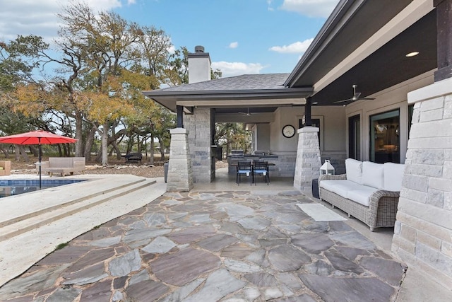 view of patio / terrace featuring outdoor lounge area, ceiling fan, and a swimming pool