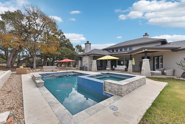 view of pool with a patio area, an in ground hot tub, and outdoor lounge area