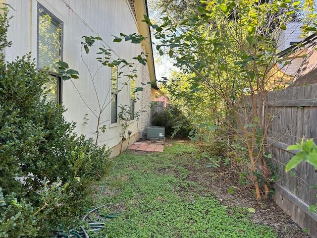 view of yard with central AC unit