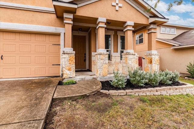 doorway to property with a garage