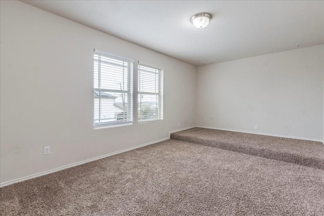 unfurnished room featuring carpet floors