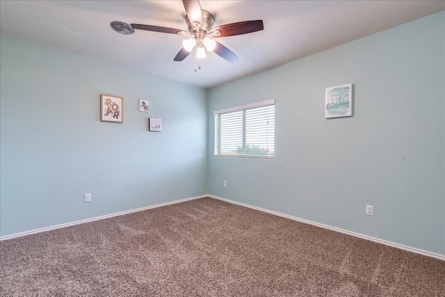 empty room with ceiling fan and carpet