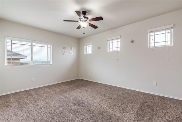 unfurnished room with carpet and ceiling fan