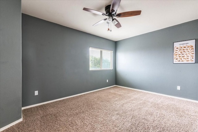 unfurnished room featuring carpet flooring and ceiling fan