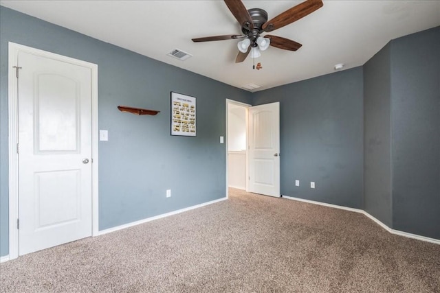 unfurnished bedroom with ceiling fan and carpet floors