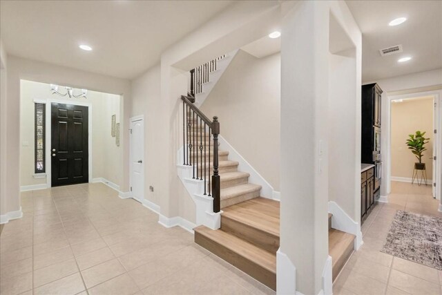 entrance foyer featuring light tile patterned floors