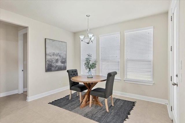 tiled dining area with a notable chandelier