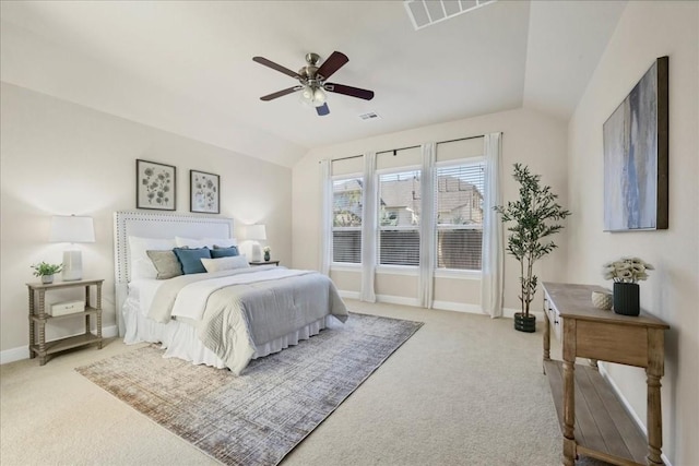 bedroom with ceiling fan, lofted ceiling, and light carpet