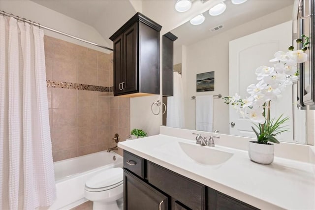 full bathroom featuring vanity, shower / bath combination with curtain, and toilet